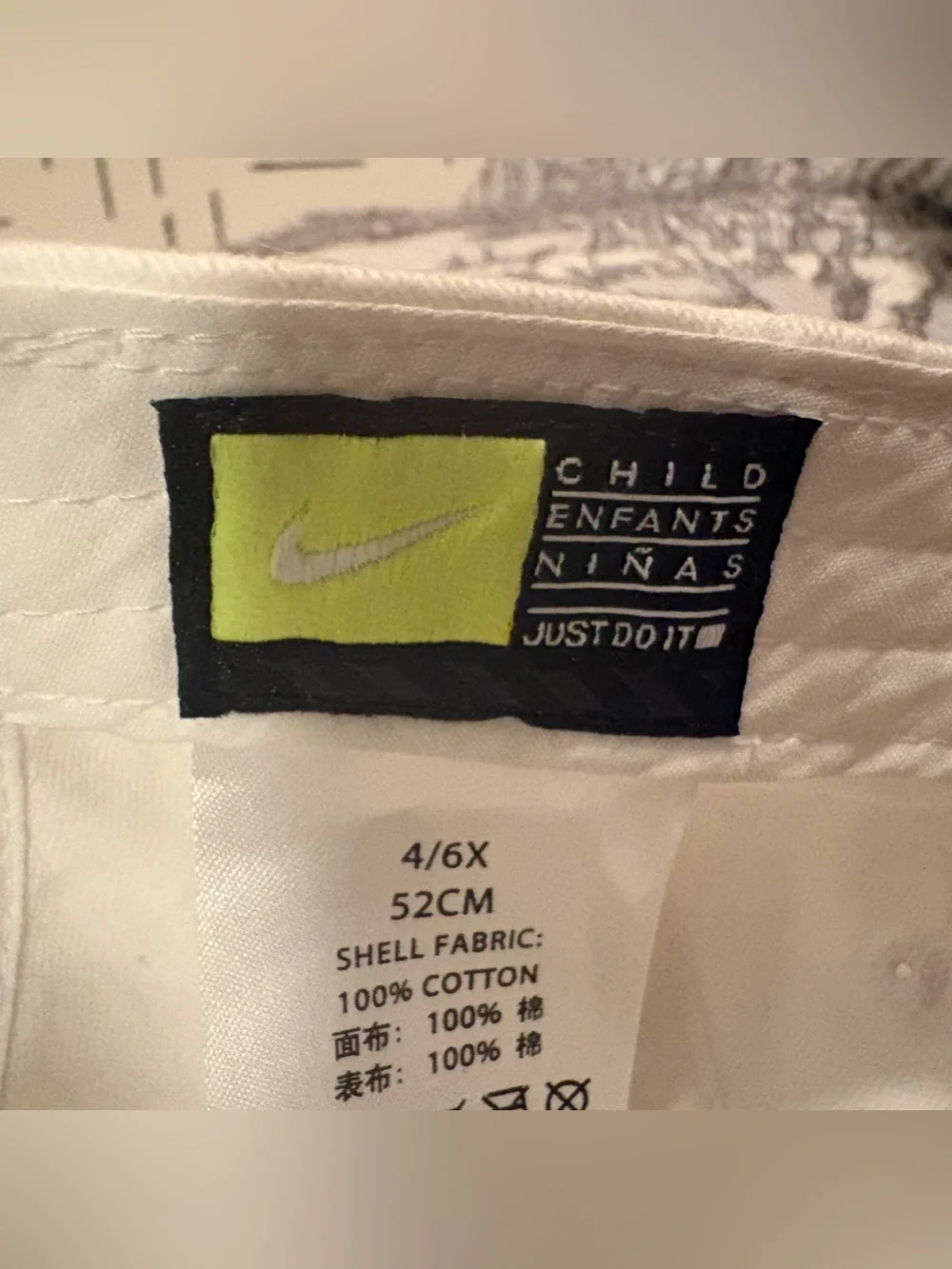 Nike Kids White Hat with Black Swoosh and Yellow Flower